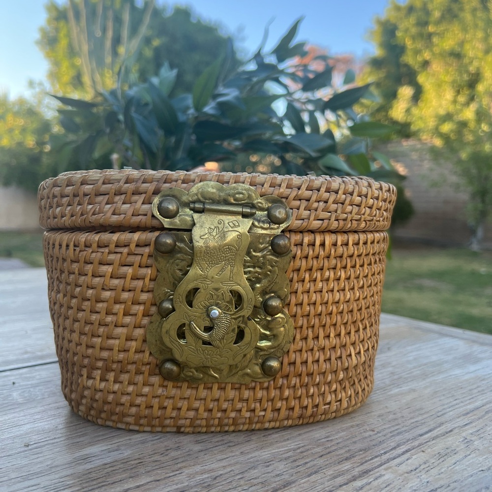 Vintage woven wicker basket purse with brass connectors.